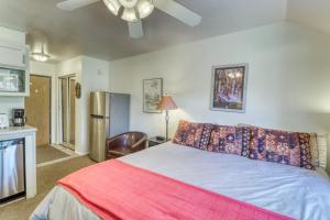 a bedroom with a bed with a red blanket at Park City Getaway in Park City +15 photos