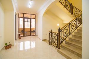 an empty hallway with stairs in a house at Tatev Hotel and Tours in Yerevan