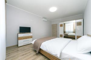 Posteľ alebo postele v izbe v ubytovaní New VIP Apartments