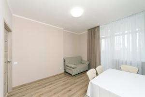Posteľ alebo postele v izbe v ubytovaní New VIP Apartments