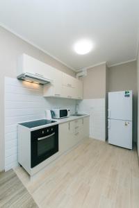 Kuchyňa alebo kuchynka v ubytovaní New VIP Apartments + 9 fotografií