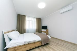 Posteľ alebo postele v izbe v ubytovaní New VIP Apartments