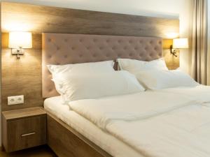Postel nebo postele na pokoji v ubytování Premium Green Apartments Vienna
