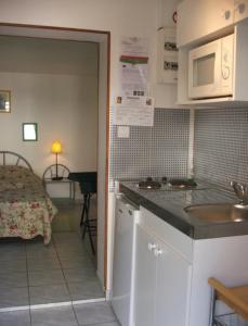 Kuchyň nebo kuchyňský kout v ubytování Chambres d'hotes Welcome Trépied