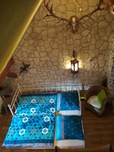 Ένα ή περισσότερα κρεβάτια σε δωμάτιο στο FERIENHAUS Grüne Franziska, perfekt für große Familien & Gruppen, nur 10min vom EuropaPark