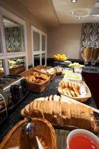 
a kitchen counter filled with lots of different types of food at Royal Eagle Hotel in London
