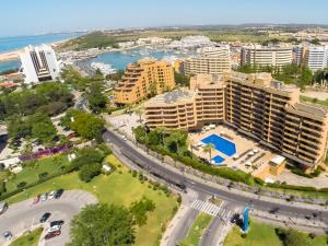 an aerial view of a resort and the ocean at Dom Pedro Portobelo in Vilamoura