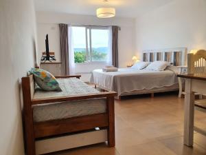 a hotel room with a bed and a window at Apart jujuy Suite Premium in San Salvador de Jujuy