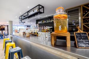 a bottle of honey sitting on top of a bar at Campanile PRIME - Marseille Aubagne in Aubagne