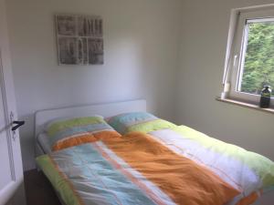 Cama ou camas em um quarto em Ferienhaus Falz Schleswig
