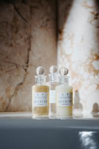 two bottles of essential oils sitting on a shelf at Elite Eden Park Hotel in Stockholm