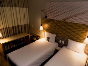 Letto o letti in una camera di Ibis Lorena - Circuito da Fé