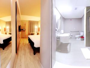 Postel nebo postele na pokoji v ubytování ibis Apartado