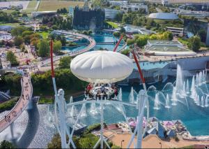 an amusement park ride with a water fountain at Les Rosiers in Chaunay
