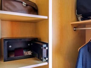 Uma TV ou centro de entretenimento em Ibis Cancun Centro
