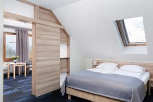 Postel nebo postele na pokoji v ubytování Nawigator SPA