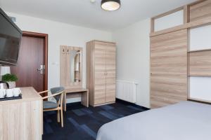 Postel nebo postele na pokoji v ubytování Nawigator SPA