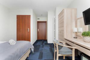 Postel nebo postele na pokoji v ubytování Nawigator SPA