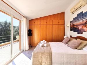 Postel nebo postele na pokoji v ubytování Villa Divuit Pins