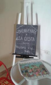 a glass table with a sign on top of it at La Casita in Neuquén