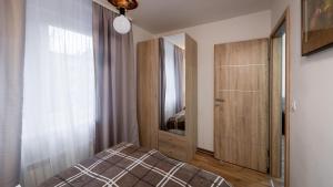 Łóżko lub łóżka w pokoju w obiekcie Apartment Krajinovic