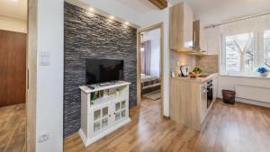 Telewizja i/lub zestaw kina domowego w obiekcie Apartment Krajinovic