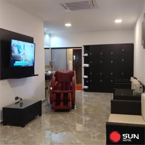 Телевізор і / або розважальний центр в Hotel Sun