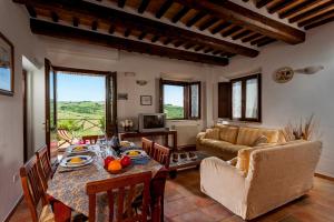 a living room with a table and a couch at Agriturismo Tre Querce in Penna San Giovanni