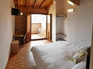 Postel nebo postele na pokoji v ubytování B&B La Atalaya