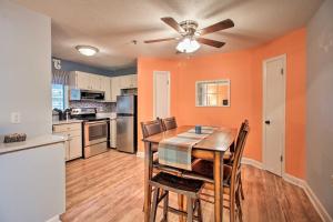 a kitchen and dining room with a table and chairs at South Carolina Condo with Beach Access, Near Golfing in Hilton Head Island