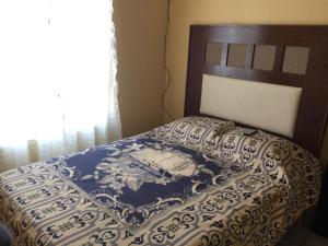 Posteľ alebo postele v izbe v ubytovaní departamentos tequila pueblo mágico 112