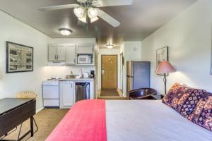 a large bedroom with a bed and a kitchen at Park City Getaway in Park City