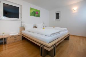 Postel nebo postele na pokoji v ubytování Tolles Einfamilienhaus nahe dem Bodensee