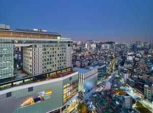 a view of a city at night with buildings at Holiday Inn Express Seoul Hongdae, an IHG Hotel in Seoul