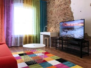 Downtown Spectrum - Location - Comfort - Style tesisinde bir televizyon ve/veya eğlence merkezi