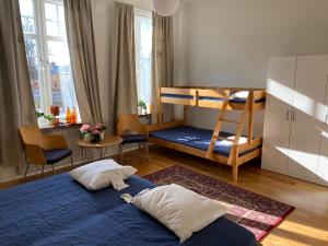 a bedroom with a bed and a bunk bed at Vänersborgs Vandrarhem in Vänersborg