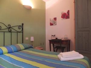 Postel nebo postele na pokoji v ubytování Cascina Antonini