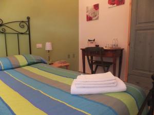 Postel nebo postele na pokoji v ubytování Cascina Antonini