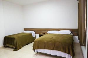 Kaluff Hotel客房内的一张或多张床位
