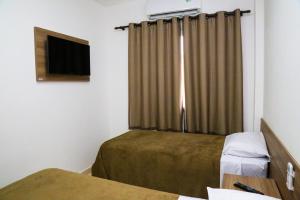 Kaluff Hotel客房内的一张或多张床位