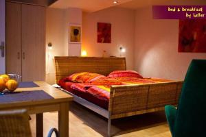 a bedroom with a large bed in a room at bed & breakfast filderstadt by heller in Filderstadt