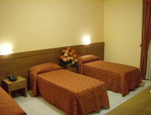 Кровать или кровати в номере Hotel Zi Marianna