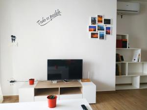TV a/nebo společenská místnost v ubytování Apartamento Cruise Views