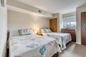 a bedroom with two beds and a window at Jamaica Place 107 in Ocean City