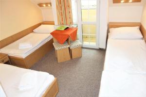 Tempat tidur dalam kamar di Hotel Zámeček