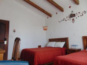Łóżko lub łóżka w pokoju w obiekcie La casa de la abuela