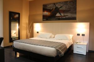 Postel nebo postele na pokoji v ubytování Hotel Garibaldi