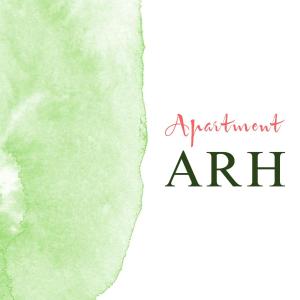 a green watercolor stain with the words achievement art at Apartment Arh in Bled