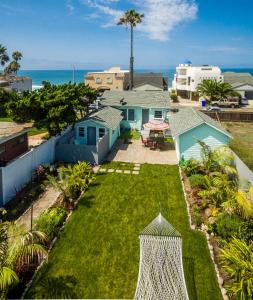 an aerial view of a yard with houses and the ocean at Pacific Bungalow in Oceanside with Backyard & Tiny House in Oceanside