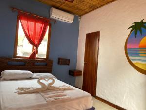 Postel nebo postele na pokoji v ubytování Hotel Karukera